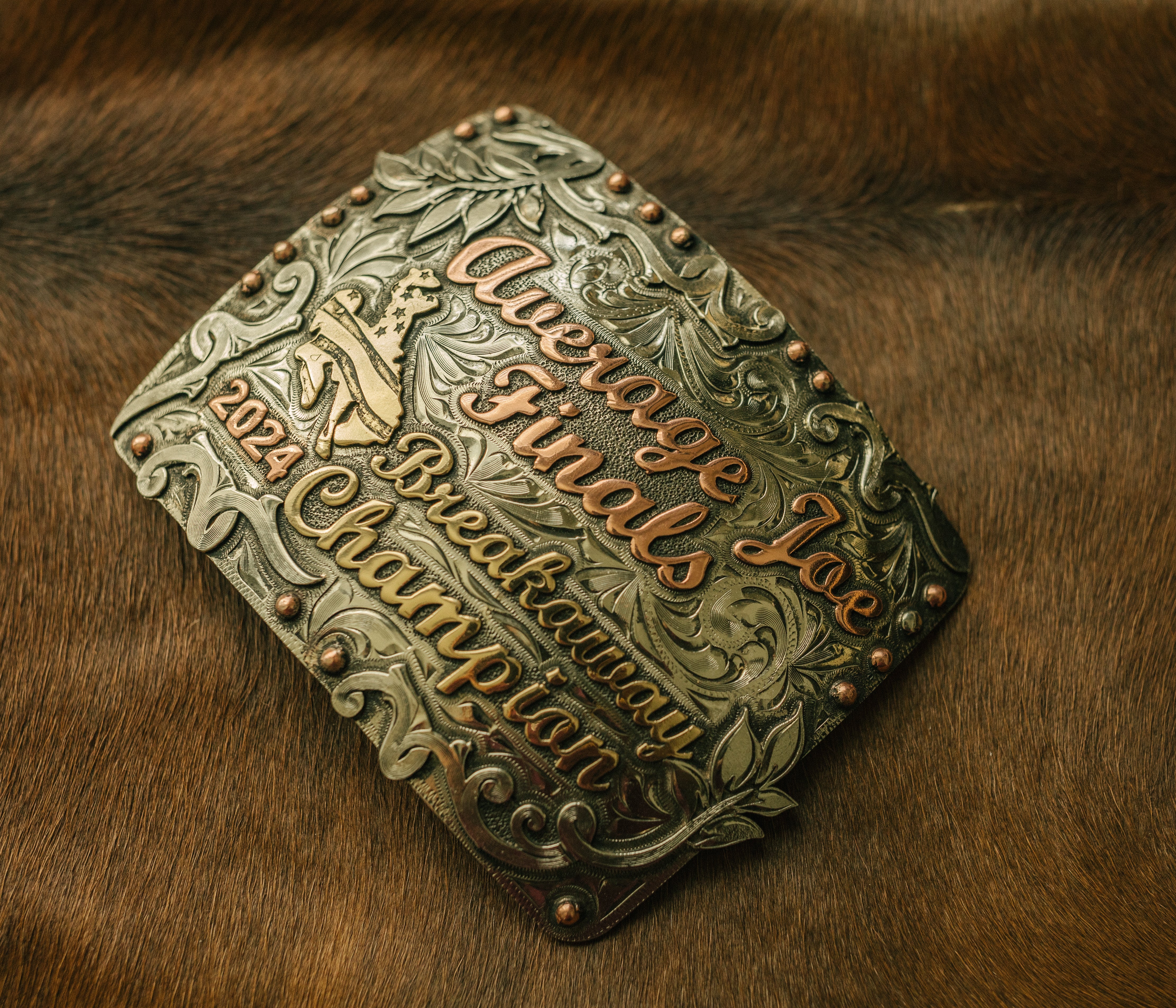 PasoRoblesphotographer-wickenburgaz-customsilver-TheRowdyRose-shelbycaitlinphotography-teamropingawards-headerandheelerbuckles-ropinawards-worldseriesroping-averagejoesroping-madonnainnropings